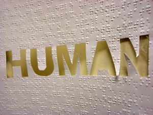 Human Touch text on braille