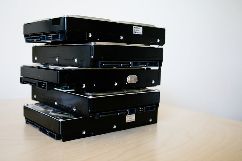 A stack of old hard disk drives