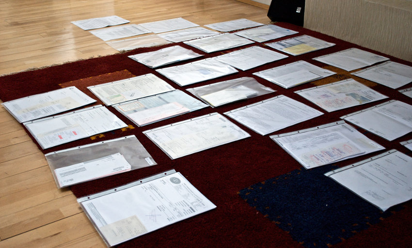 Sorting invoices on the floor