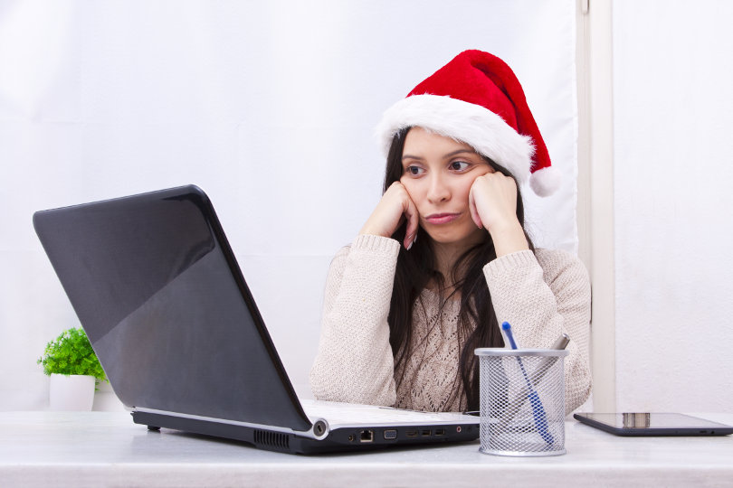 Business woman wearing Christmas hat