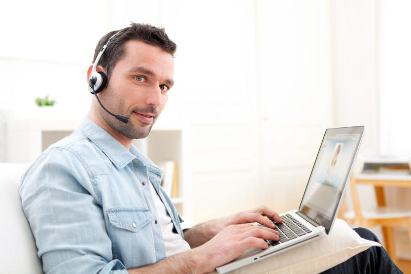 Young businessman doing conference call during online course