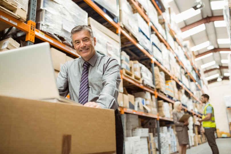 Warehouse manager working with Warehouse Mangement System (WMS)