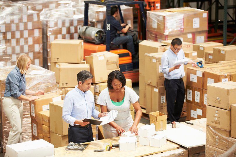 Warehouse workers preparing for goods distribution