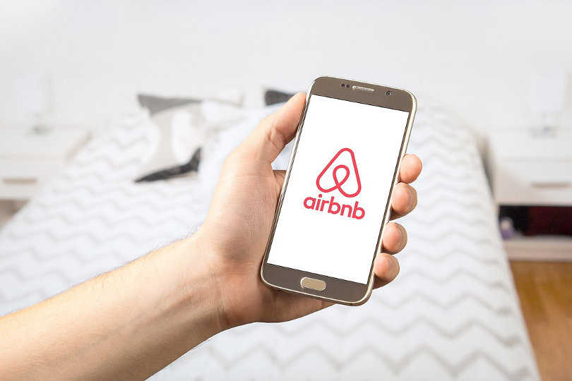 AirBnB logo on a smartphone