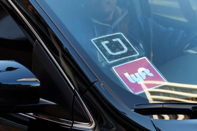 Uber and Lyft logos on windscreen