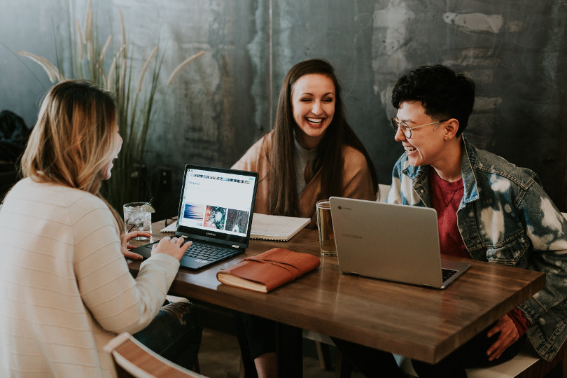 Happy employees discussing