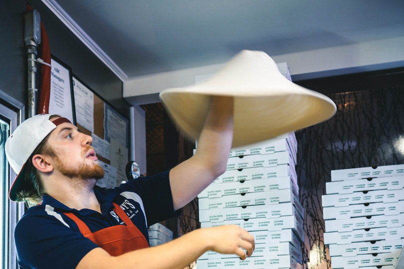Passionate pizza shop owner