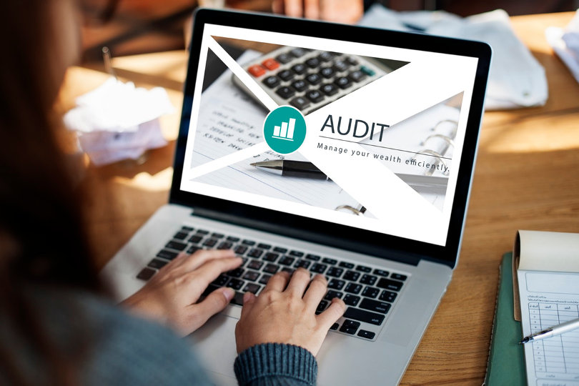 Businessman using auditing software